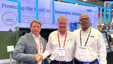 CellCube CEO ALexander Schoenfeldt, left, poses with G&W Electric CEO John Mueller, center, and Pat Avery, vice president for power grid automation at G&W