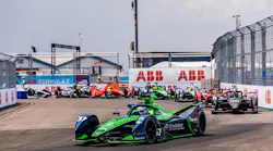 Envision team driver Nick Cassidy holds the front position in Saturday's NYC E-Prix race. He went on to win despite a rain-related crash. Image credit Formula E and ABB