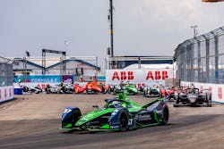 Envision team driver Nick Cassidy holds the front position in Saturday&apos;s NYC E-Prix race. He went on to win despite a rain-related crash. Image credit Formula E and ABB
