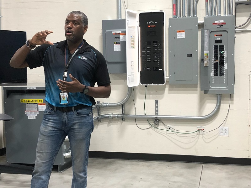 Rodney James, emerging technology development manager at Duke Energy, explains some of its home panel study work to visitors from the T&D World Conference in Charlotte