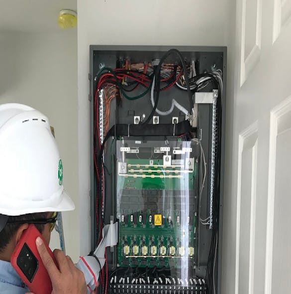 Checking smart meter panel inside Prototype House A. Image courtesy EPRI