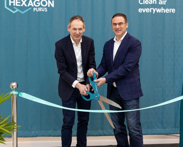 Hexagon Purus CEO Morten Holum, left, and Jim Harris, managing director, celebrate the ribbon cutting of the company&apos;s new hydrogen cylinder plant in Westminster late last week. Image credit Hexagon Purus.