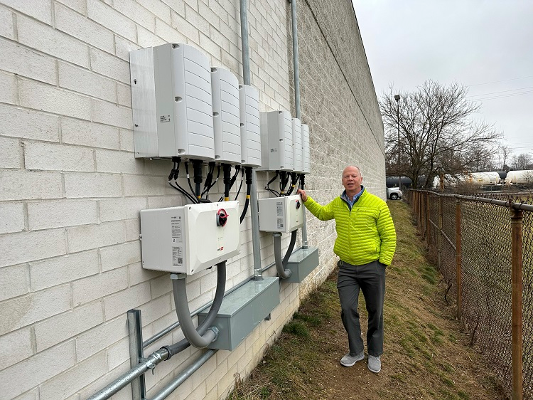 Parkway Honda Partner Mark Mears at the edge of the dealership next to some on-site generators. Image courtesy Parkway Auto Group