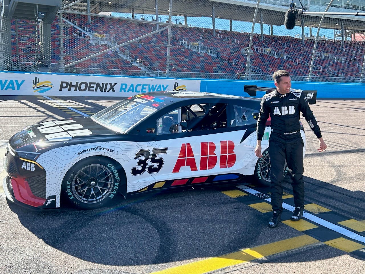 EV prototype test driver David Ragan steps out of the No. 35 car after it made a lengthy test run on the Phoenix Motor Speedway track. Image credit Rod Walton