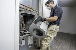 HVAC heat pump repair and replacement. ID 179458274 © David Spates | Dreamstime.com HVAC heat pump repair and replacement. ID 179458274 © David Spates | Dreamstime.com
