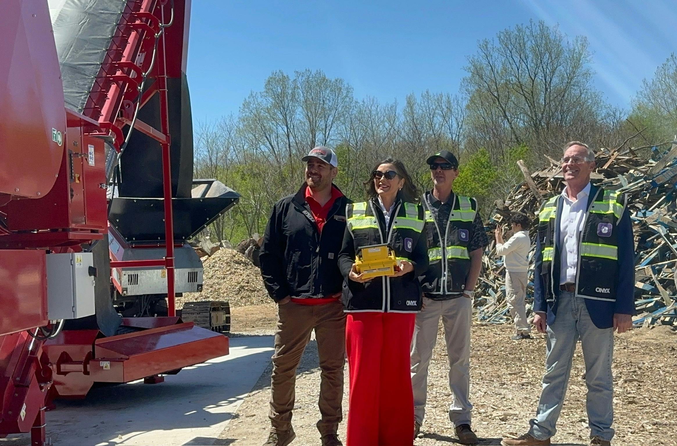 Michigan Gov. Gretchen Whitmer, center, visits the Woodchuck AI-enabled bio mass facility. Image credit Woodchuck/Business Wire