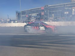 Instantaneous power spins tires and stirs up smoke and fan interest in the EV Prototype at the NASCAR Championship Weekend. Image credit Rod Walton Instantaneous power spins tires and stirs up smoke and fan interest in the EV Prototype at the NASCAR Championship Weekend. Image credit Rod Walton