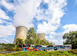 Welcome sign and cooling towers of the EDF nuclear power plant of Nogent-sur-Seine, France. Nogent-sur-Seine, France. Image credit ID 196326600 © Olrat | Dreamstime.com
