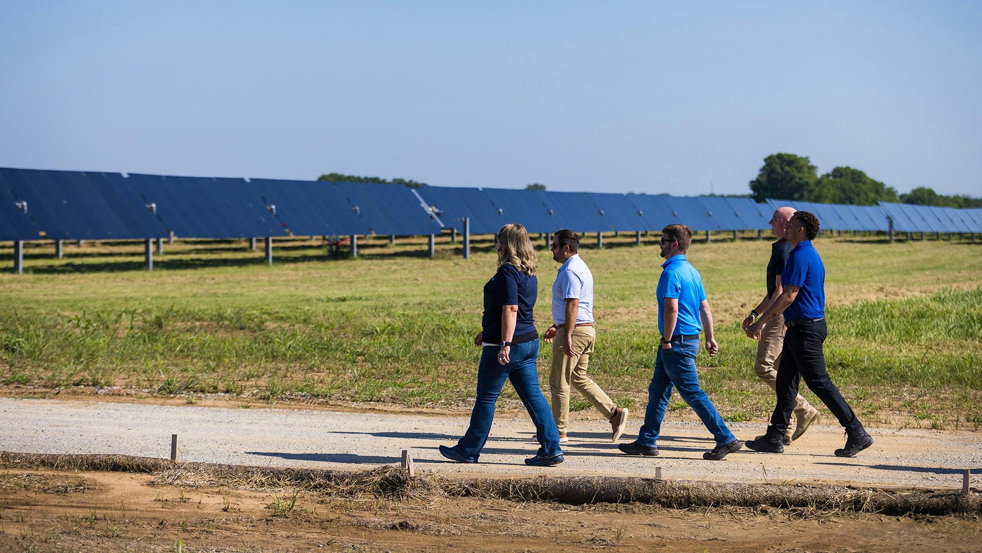 A team from LRE walks out to one of their solar projects in Oklahoma. Image credit Leeward Renewable Energy