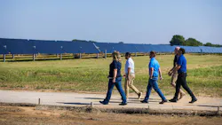 A team from LRE walks out to one of their solar projects in Oklahoma. Image credit Leeward Renewable Energy