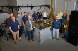 Researchers and partners from Lawrence Livermore National Laboratory and Pacific Fusion gather around the Sirius pulsed-power prototype. Image credit Garry McLeod/LLNL