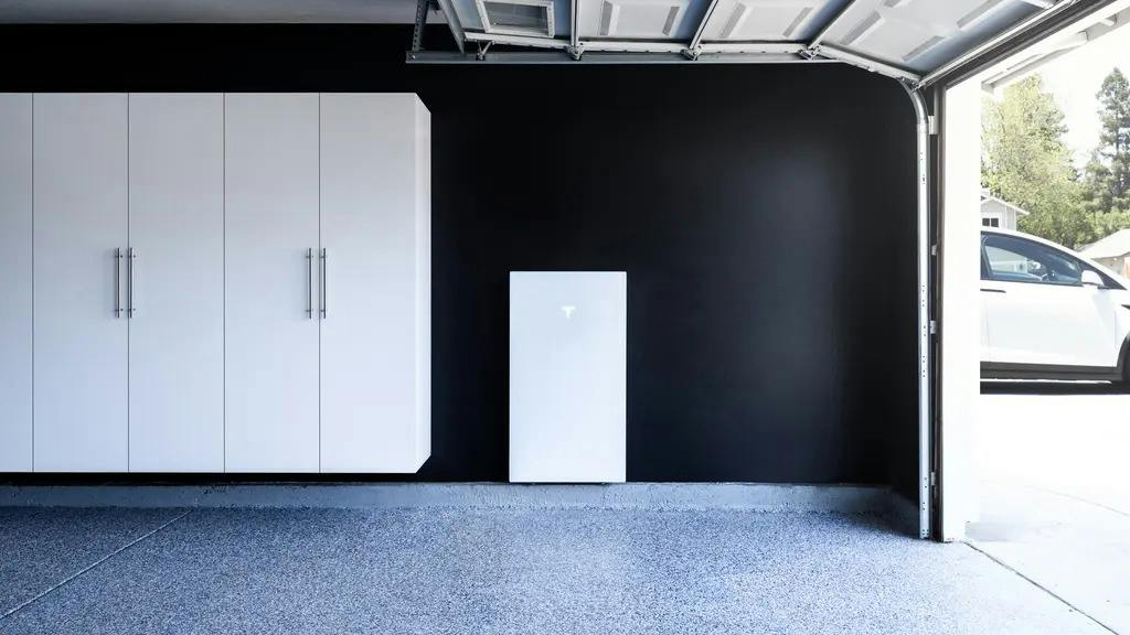 Wall-mounted Tesla Powerwall battery backup system in residential space. | Credit: Sunrun