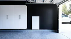 Wall-mounted Tesla Powerwall battery backup system in residential space. | Credit: Sunrun